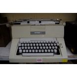 A vintage Hermes 9 cream typewriter.