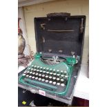 A vintage Corona green typewriter, in case.