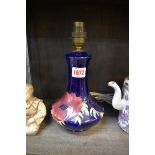 A Moorcroft vase form table lamp, height excluding fitting 19.5cm.