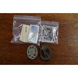 Two World War II German military badges; together with 'Medals & Orders' cigarette cards (2 sets).