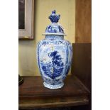 A Dutch Delft vase and cover, 38cm high, (finial restuck).