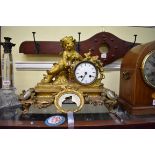 A late 19th century ormolu and Sevres style mounted figural mantel clock, 46cm wide.