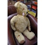 A large vintage teddy bear, 89cm long.