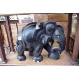 An ebony elephant, with bone tusks, 31.5cm high.