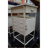 A set of three vintage white painted metal side tables, each with melamine top, 40cm wide.