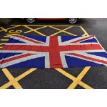 A large Union flag, 375 x 192cm, labelled 'Porter Bros Ltd, Kings Dock Mill, Liverpool'.