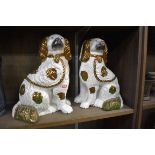 A pair of Victorian Staffordshire pottery spaniels, 28cm high.