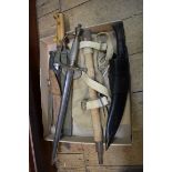 A collection of knives, to include a 1938 kukri and sheath;  a machete and sheath; and an