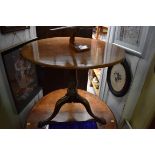 A George III mahogany circular tilt top tripod table, 79.5cm diameter.