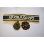 An Afrikakorps cuff title; together with a Russian front medal and a driver's badge.