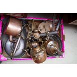 A collection of copper kettles and saucepans.