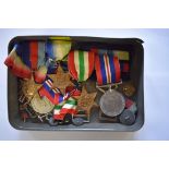 Two groups of World War II medals.