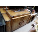 An Art Deco figured walnut side cabinet, 136cm wide.