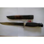 A vintage knife and leather scabbard, by J Rodgers & Sons, with carved ebony handle.