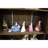 Eight Royal Doulton figures, to include 'The Mask Seller', HN2103, (chip to hat); and 'The Little