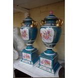 A pair of Sevres style porcelain twin handled vases and covers, 44cm high.