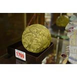 An antique carved lacquer ball, possibly Chinese, 7.5cm diameter.