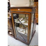 An Edwardian mahogany and inlaid display cabinet, 64.5cm wide.