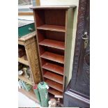 A contemporary mahogany tall narrow bookcase, 133cm high x 34cm wide.