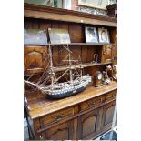 A reproduction oak panelled dresser and rack, 156cm wide.