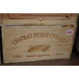 A case of twelve 75cl bottles of Chateau Picque Caillou, 2000, in owc. (12)PLEASE NOTE: ADDITIONAL