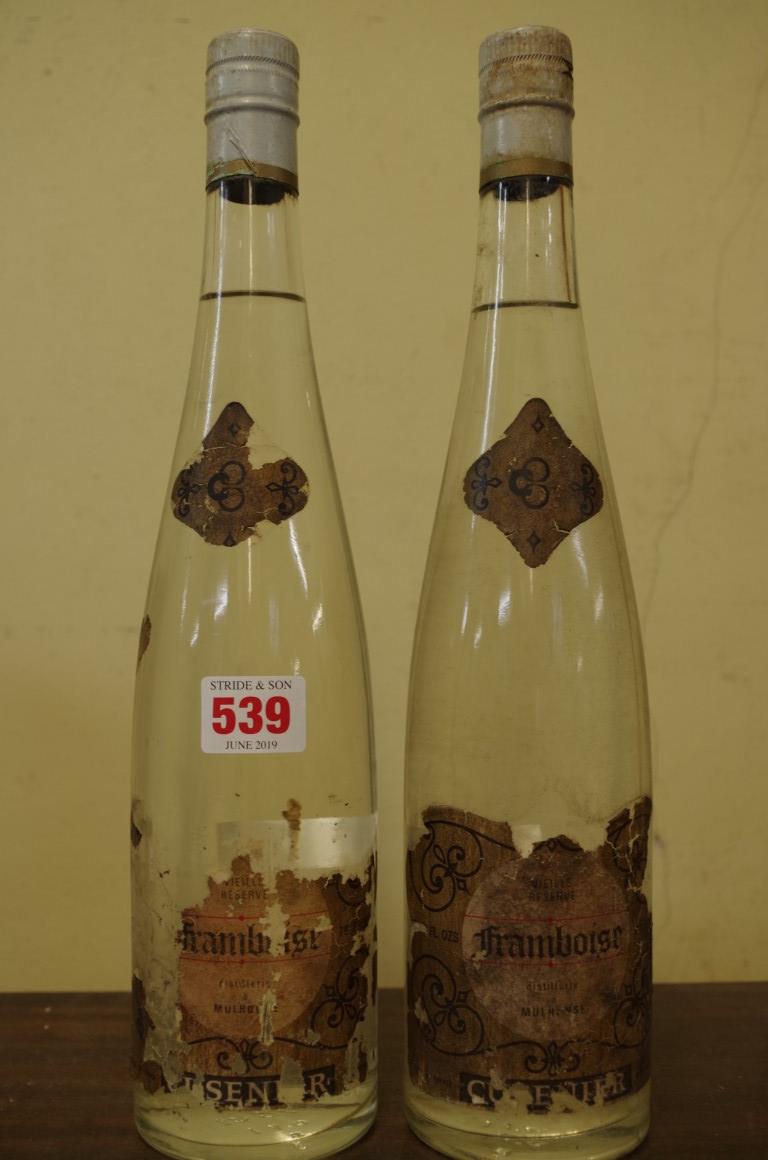 Two 24 1/2 fl.oz. bottles of Cusenier Framboise Vieille Reserve. (2)