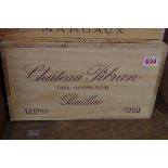 A case of twelve 75cl bottles of Chateau Pibran, 1990, in owc.PLEASE NOTE: ADDITIONAL VAT ON THE