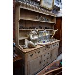 A 19th century pine dresser and rack, 182cm wide.