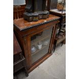 A late Victorian walnut and inlaid pier cabinet, 76cm wide.