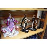 Three Franklin Mint Erte figures; together with another Franklin Mint figure.