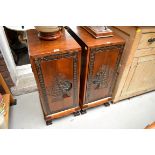 A pair of Oriental carved hardwood bedside cupboards, 37cm wide.