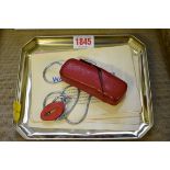 A Minox miniature camera in red leather case, circa 1951, No. 33989, with instruction booklet.