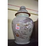 A Japanese Satsuma pottery vase and cover, painted with a bat and mythical birds, 39.5cm high, (