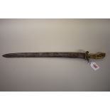 An 18th century German hunting sword, having 43cm steel blade, the brass handle shaped as a deer's