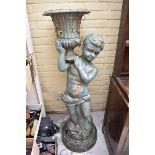 A large cast iron figural urn, 131cm high.