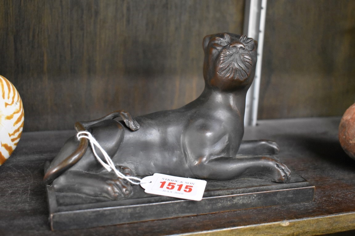 A bronze figure of a panther, 20cm wide.