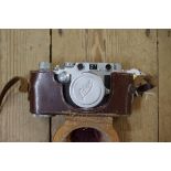 A Leica IIIc camera, No 368821, circa 1941, with Leitz Summitar f=5cm 1:2 lens, No 660554, with