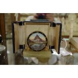 A small Art Deco timepiece, 6.2cm high, in fitted case.