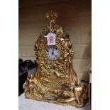 A gilt metal mantel clock, 34.5cm high.