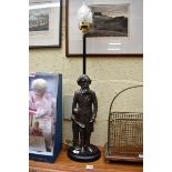 A Banksway cast iron Charles Dickens and Oliver Twist table lamp, the figures 40cm.