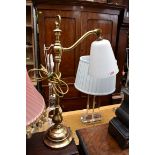 A brass table lamp, with adjustable bracket.