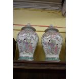 A pair of Samson famille rose vases and covers, 42.5cm high.