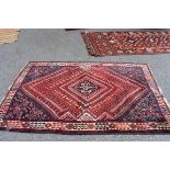 A South West Persian rug, having central diamond medallion, with allover floral and geometric