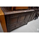 An 18th century style oak panelled mule chest, 106cm wide.