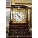 A 19th century Chinese centre seconds mantel clock, with enamel circular convex dial, twin chain