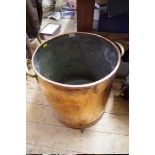 A large old copper twin handled grain bin, 46.5cm high.