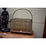 An old oak and brass magazine rack, 36cm wide.