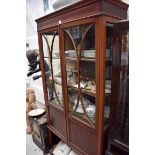 An Edwardian mahogany and inlaid display cabinet, 89cm wide.