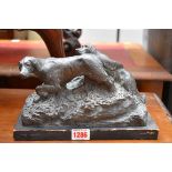 A bronzed figure group of two gundogs, inscribed 'GP', 23.5cm wide, on wood base.