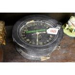 A vintage US Navy bulkhead timepiece, the 24 hour dial numbered 26513-E, 19.5cm diameter.